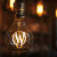 Image of a lightbulb with a glowing 'W' for WordPress, emphasising that managed hosting is a good idea.